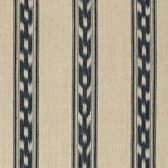 This pattern features a distinctive ikat stripe on a solid linen-jute ground. Made using an artisanal weaving technique,...