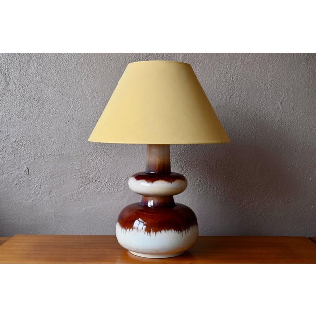 It commands attention in a room effortlessly; sculptural, warm, and magnetic, this large lamp from the 1960s-70s features...