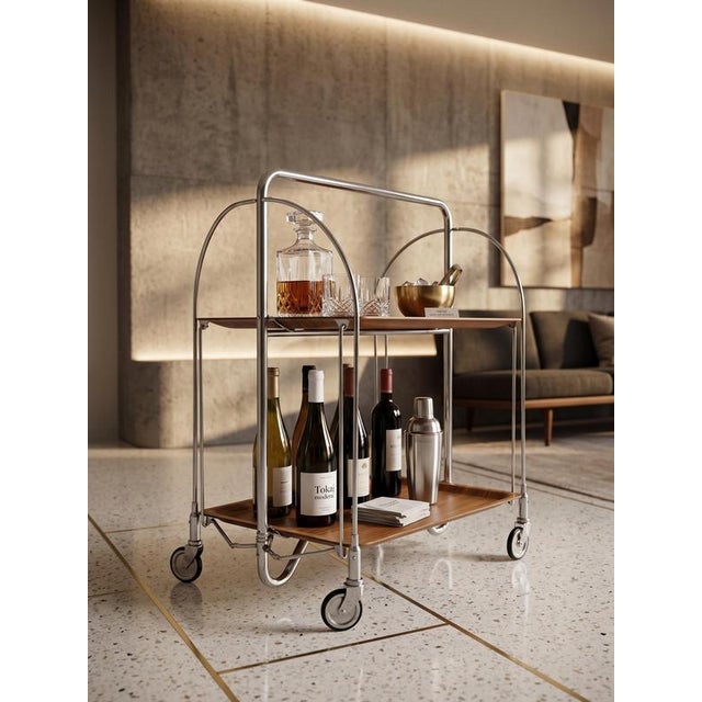 Mid-Century Modern folding serving cart / bar trolley, model "Dinett", manufactured by the renowned German firm Bremshey &...