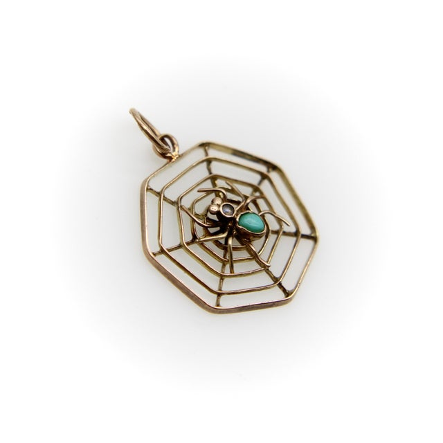 This adorable spider pendant is from the Victorian era. Housed in a delicate web made of 9k gold strips, a sweet spider is...