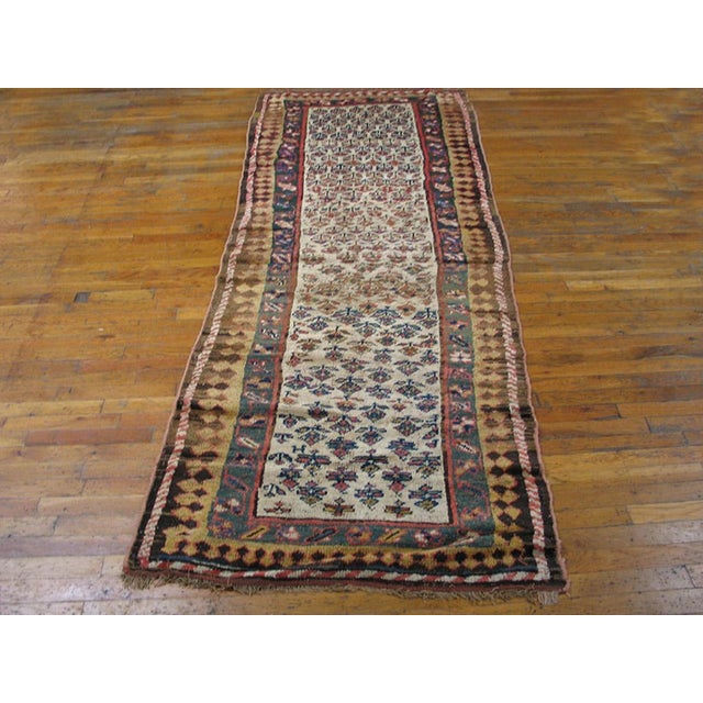 Antique Persian Kurdish rug. Size: 3'4" x 9'4". Antique Kurdish Persian Ivory 1890s Rug, Circa Date: 1890s. This...