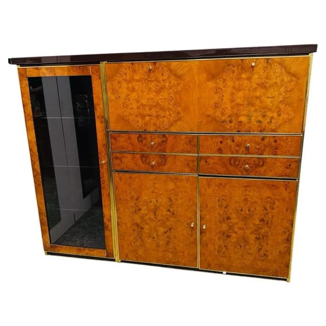 Elegant original tall sideboard from the 1970s, an emblem of luxury Italian modernism. The frame features doors and...