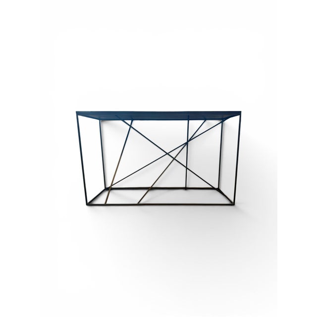 Michael Dawkins Mikado Console Table - Black Matte Wood Top with Black Metal Base. Architectural elegance meets functional...