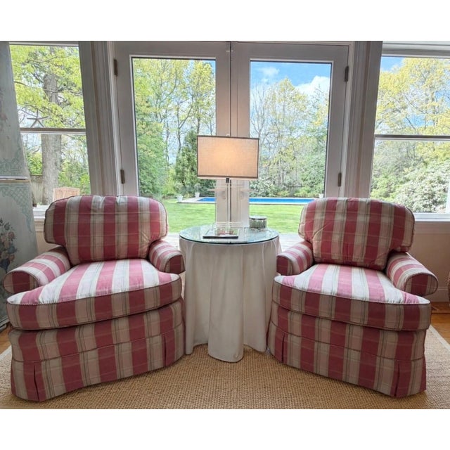 A Pair of Custom Pink Plaid Pleated Skirt Lounge Chairs by Vanguard Some chairs are designed to disappear politely into a...