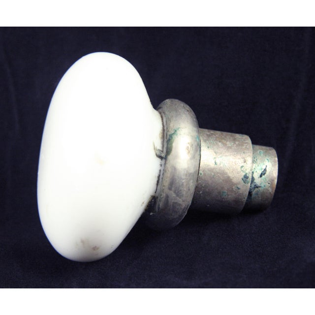 A round vintage white milk glass door knob paired with a rosette. Priced as one knob and one rosette. Good condition with...