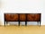 An elegant low sideboard made in France, dating from the 1950s, blending classic aesthetics with the refinement of postwar...