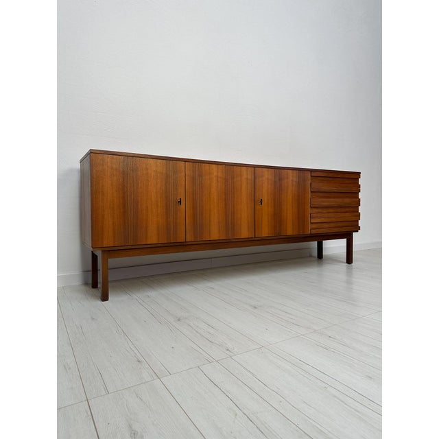 Large Vintage Mid-Century Danish walnut sideboard from the 1960s. Beautifully crafted from warm, richly grained walnut...