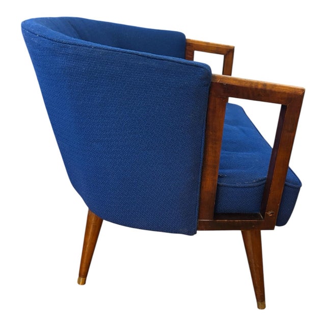 Bright Blue Century Modern chair is made of fabric and and wood, standing at a height of 27 inches and with a length of 29...