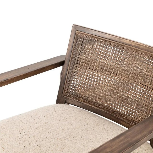 An antique style is reimagined with a rich cane backing and sustainably made, stone-washed Belgian Linenâ„¢. Detailed with...