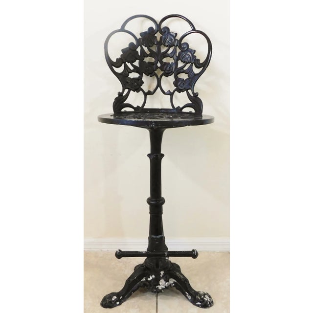 Amazing vintage mid century ornate black aluminum roses paw foot swivel bar stool. Circa 1940s/1950s. American made....