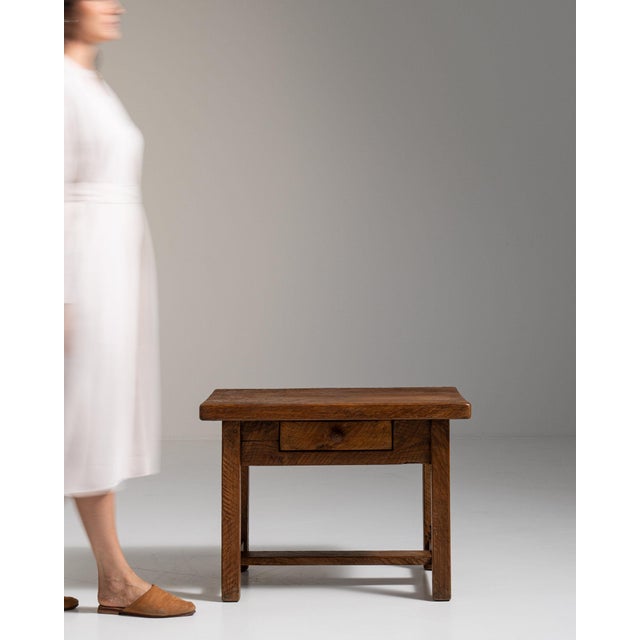 Single-drawer side table in Honey Oak. The honey oak surface highlights turned legs, original bail pull, warm honeyed...