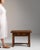 Single-drawer side table in Honey Oak. The honey oak surface highlights turned legs, original bail pull, warm honeyed...