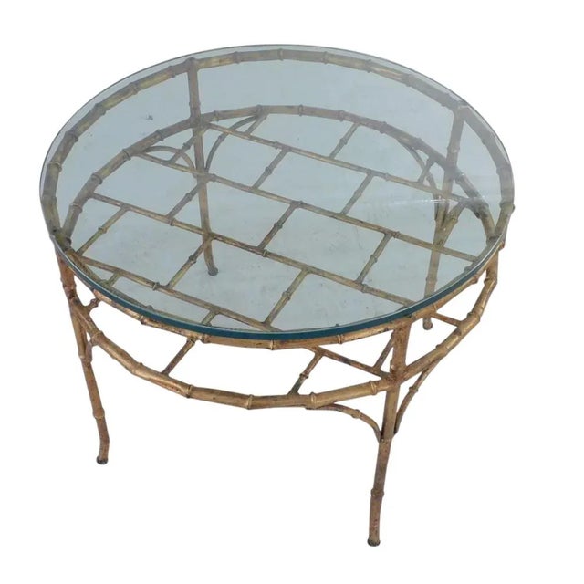Faux bamboo gilt circular metal coffee table. Made in Italy. Good condition, with clear glass top.