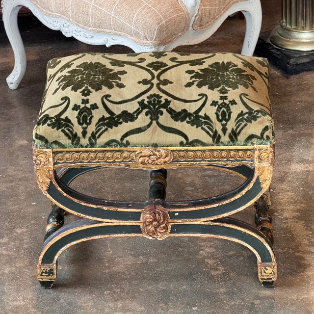 Rectangular upholstered stool with shaped seat rail, the frieze carved with a central rosette and continuous molded...
