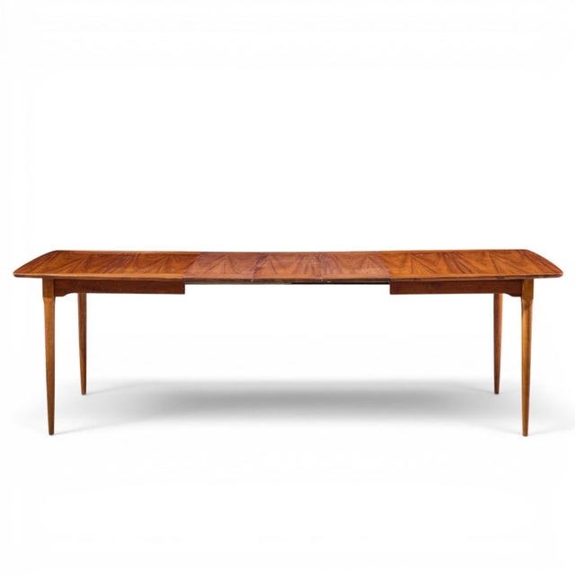Ramseur Mid Century Walnut Expanding Dining Table with 3 Leaves This table measures: 62 wide x 40 deep x 29.5 inches high,...