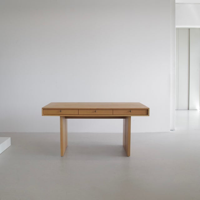 Architect-designed desk, which can be utilised from both sides. Each side comprises three top drawers. Beautiful honey-...