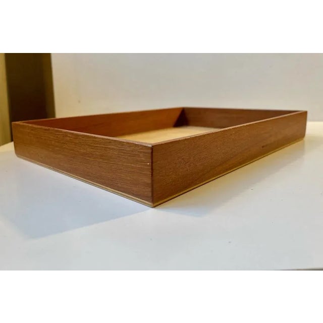 Rectangular desk tray by ehapa made in denmark during the 1970s. It has a solid brass frame on top of a pine veneer....