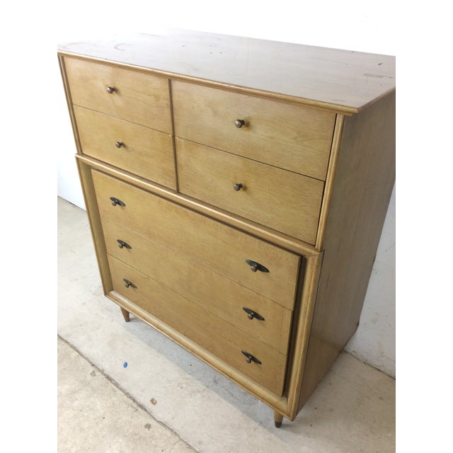 This mid century modern highboy dresser features hardwood construction, original limed walnut finish, five dovetailed...