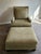 Exceptional Baker lounge chair and matching ottoman presented in virtually unused, showroom-like condition. Upholstered in...