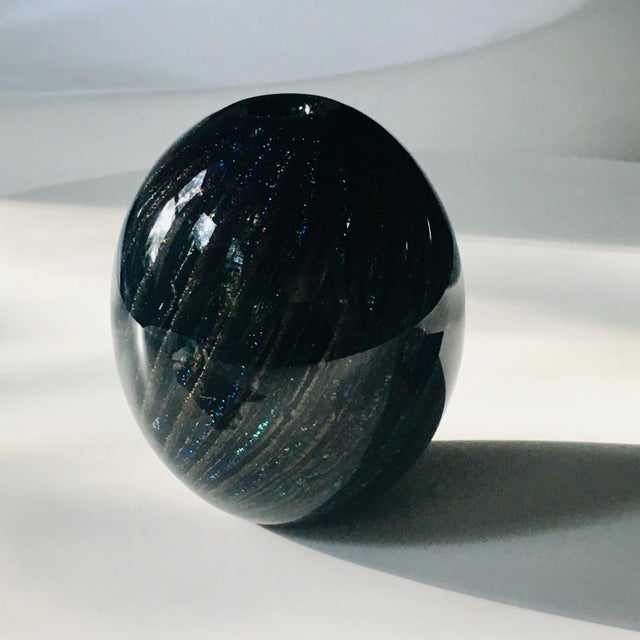 Black colorful iridescent art glass vase by Robert Eikholt. Hand blown. Signed and dated 1985. In excellent condition, a...