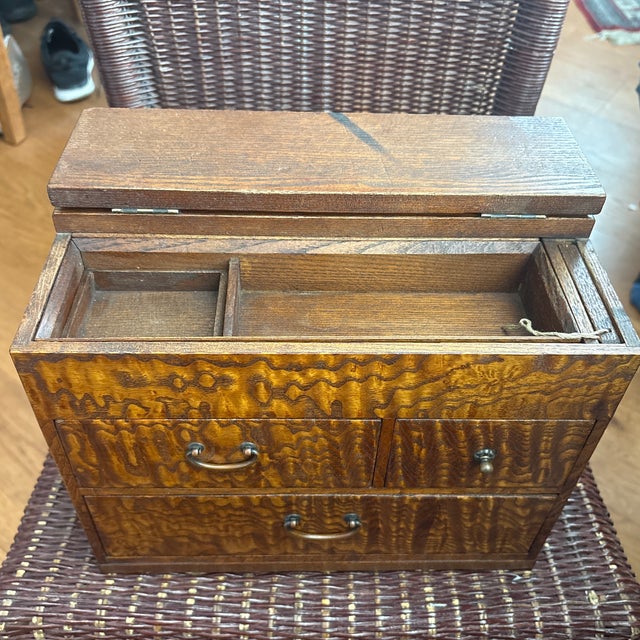 Circa 1920 (Taisho period) this Japanese sewing work box is made of highly figured mulberry wood and of the most beautiful...