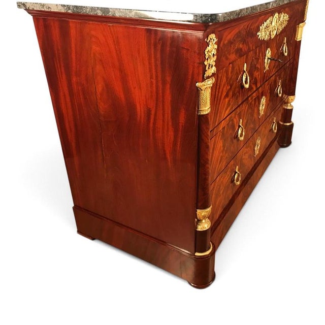 Exceptional French Empire Mahogany Commode with Gilt-Bronze Mounts, circa 1810 This exceptional French Empire mahogany...