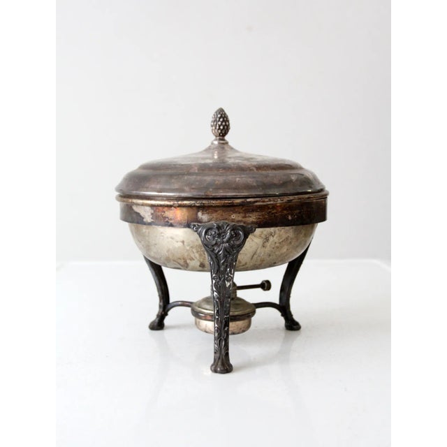This elegant early 20th century silver plated chafing dish is a timeless piece for any occasion. With its distinctive...
