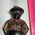 This is an antique A.C. Williams "Sharecropper" still bank, produced around 1910.The cast iron bank depicts a caricature...