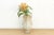 This vessel represents a classic form in East Asian ceramics, distinguished by its elegant butterfly-wing handles and a...