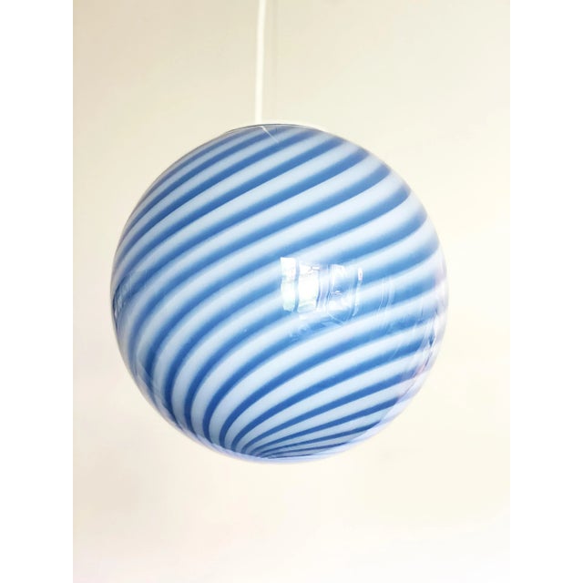 Impressive contemporary blue and milky-white Sphere in Murano Glass Swirl Venini style Design in very particular and...