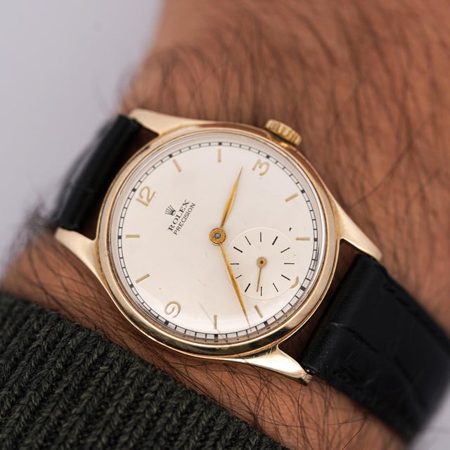 Vintage Rolex Precision 12325 manual-wind watch in yellow gold featuring calibre 710 movement with off-white dial and...