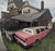 State Ave. Stretch by Brad Davis | Oil on wood panel Pink limousine parked near a house. For Sale