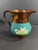 This mid 19th century Copper painted pitcher with vivid teal glaze and brightly colored scenes is made in the 1850's in...