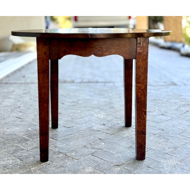 This rustic European table is 35” wide and 34” tall. The top can lift off for easier transport since it is solid mahogany...