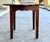 This rustic European table is 35” wide and 34” tall. The top can lift off for easier transport since it is solid mahogany...