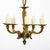 Petite chandelier from France made of solid bronze. This fixture features five candelabra arms and an acorn finial. This...