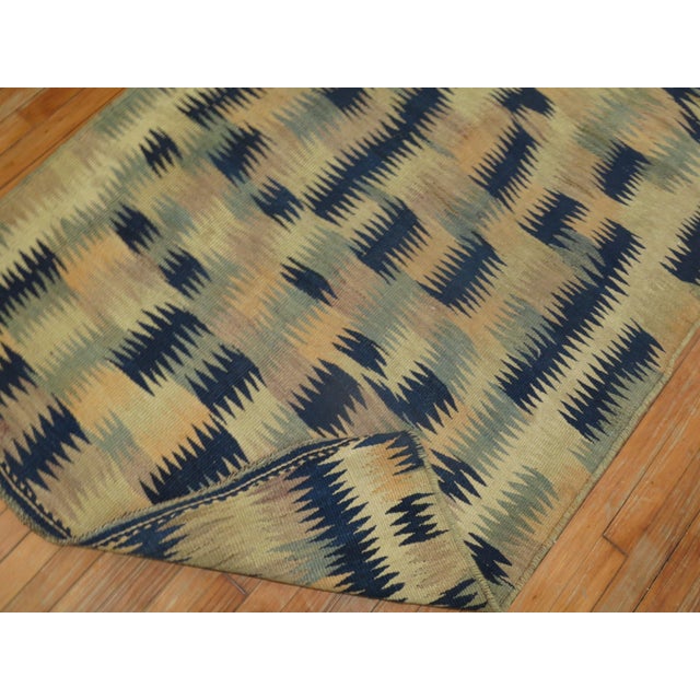 A primitive midcentury Turkish Kilim. Measures: 4' x 9'7".