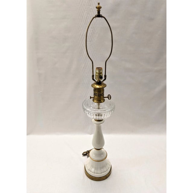 A vintage Hollywood Regency opaline and glass lamp signed by Paul Hanson from the 1940s. The 19th-century columnar body...