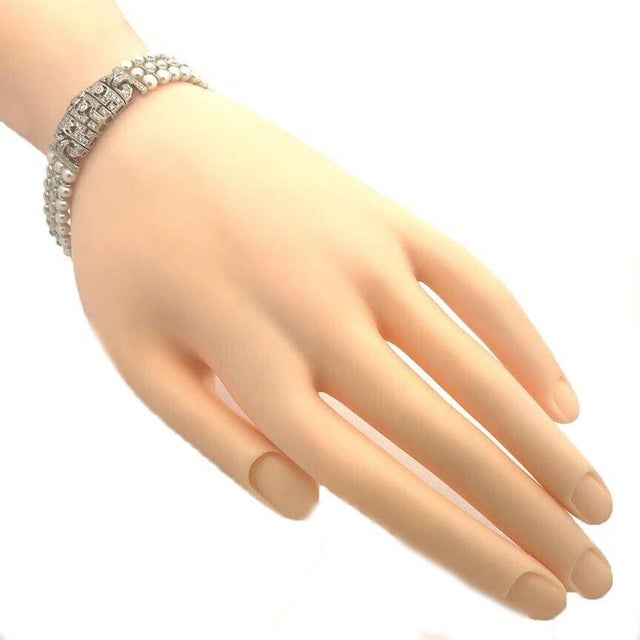 This beautiful estate bracelet is crafted from 18k white gold featuring an open design long rectangle shape center motif...