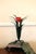 An excellent vintage vase, shaped metal leaves with a center metal vase. It sits on top of a base with scrolled feet,...