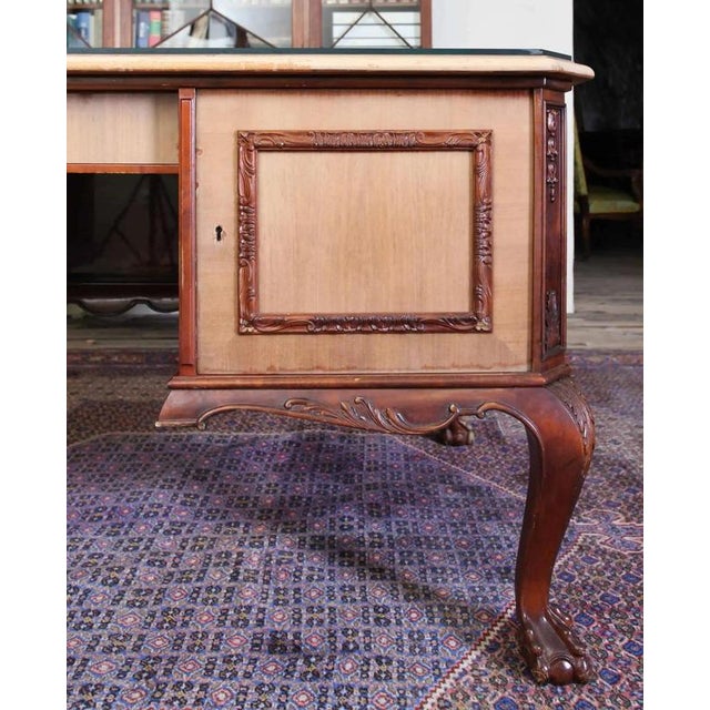 Spacious Chippendale writing desk decorated with fine carving. Elegant legs topped with an animal paw. Practical...