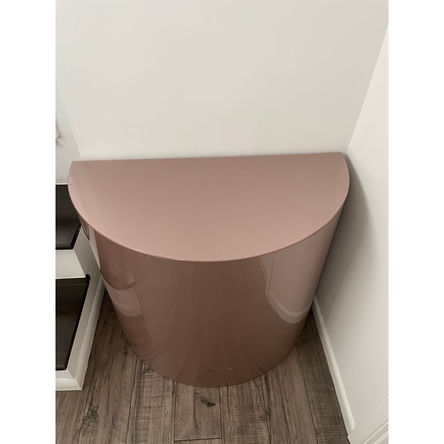 Large, 1980s metallic pink acrylic half moon pedestal. In overall good vintage condition with some wear and tear (see...