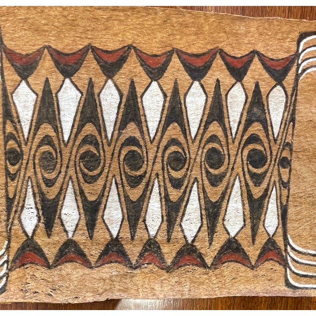This authentic piece of indigenous Oceanian art is a hand-painted bark cloth from the Lake Sentani region of West Papua,...