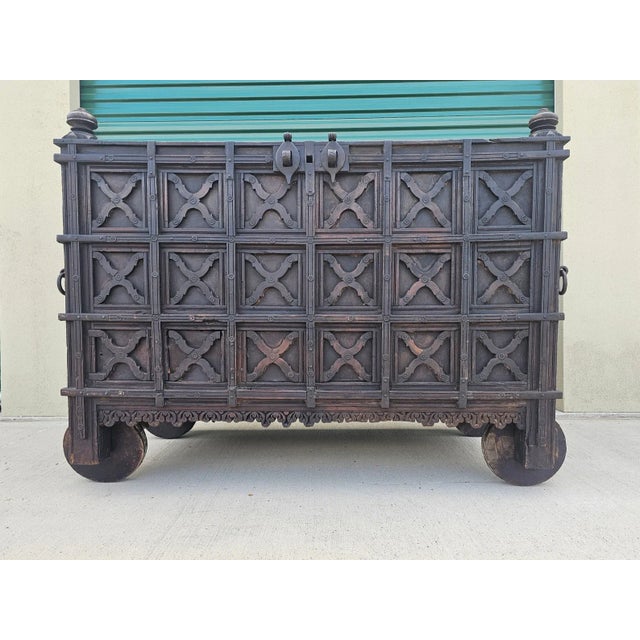 A magnificent antique metal-bound solid teak wood damchiya marriage dowry chest with hidden compartments and beautifully...