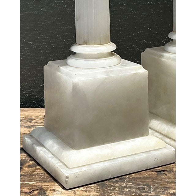 This pair of monumental table lamps captures the scholarly elegance of the Grand Tour era, expertly carved from solid...