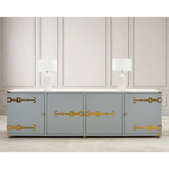 A sublime mid-century modern marble top sideboard or credenza designed by Tommi Parzinger (German 1903-1981) for Parzinger...