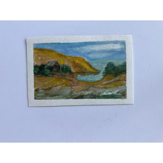 Landscape featuring an a little shack by an inlet. Signed and ready to frame.