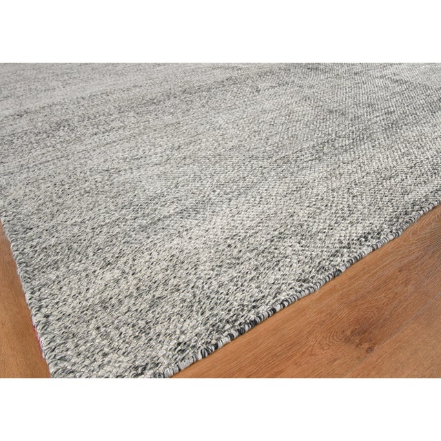 The Rhodes collection is a flatweave construction made of yarn dyed PET fibers. The subtle tweed appearance of the...
