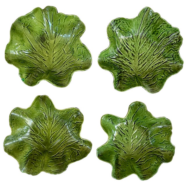 A striking set of four handmade ceramic leaf bowls by Pat Young, circa the 1950s. Each bowl features deeply textured leaf...