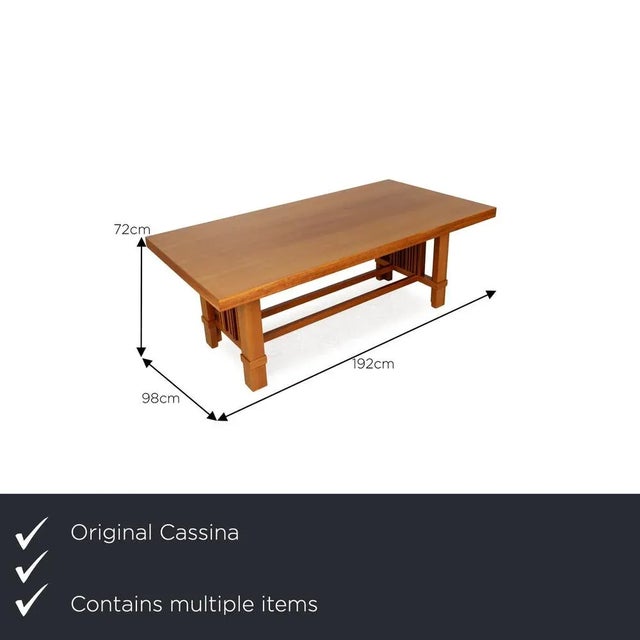 The Taliesin table set from Cassina is made of brown cherry wood and impresses with its stylish, solid design. The set...